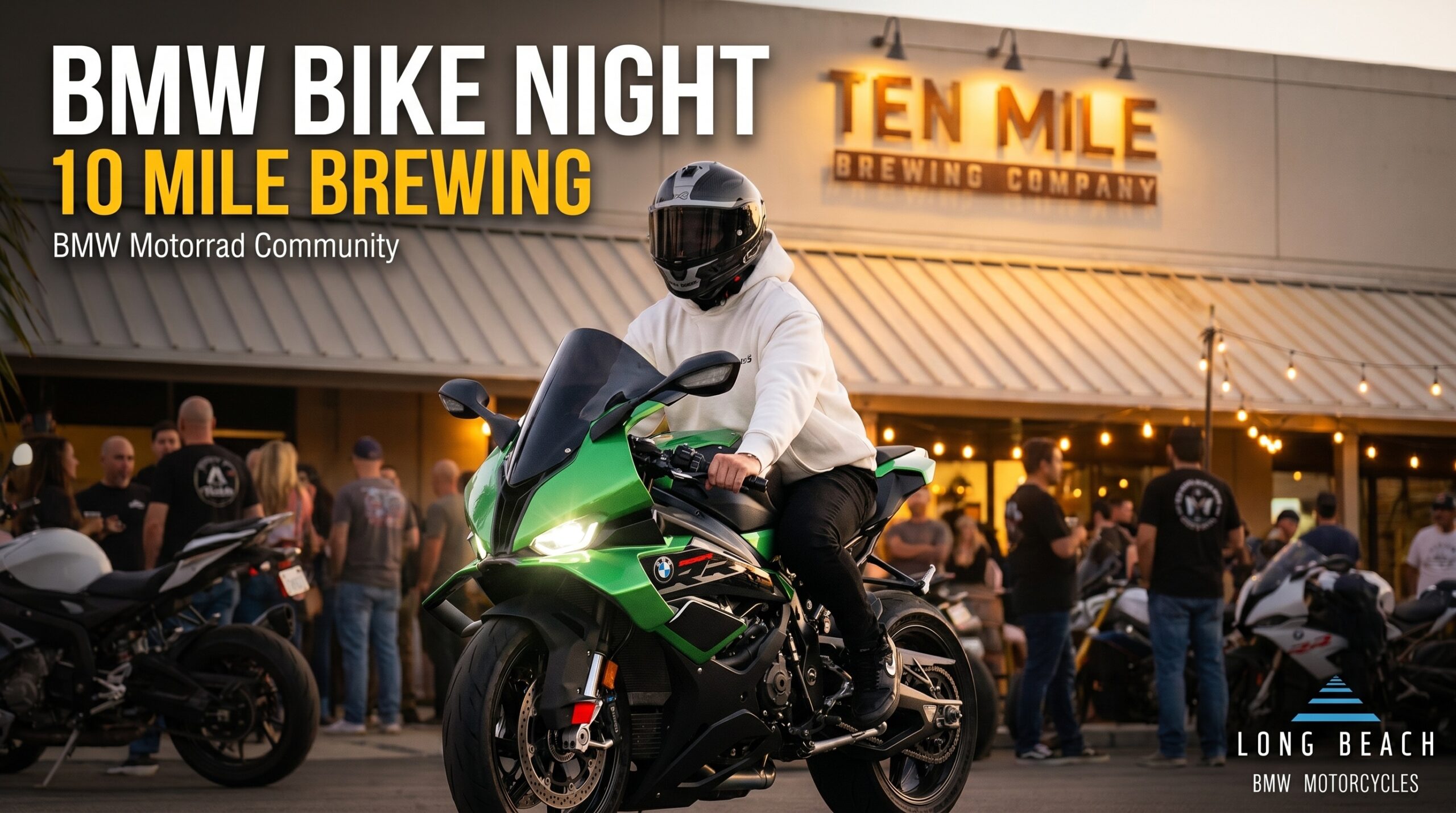 A rider on a green BMW S 1000 RR at a Bike Night event hosted by Long Beach BMW Motorcycles